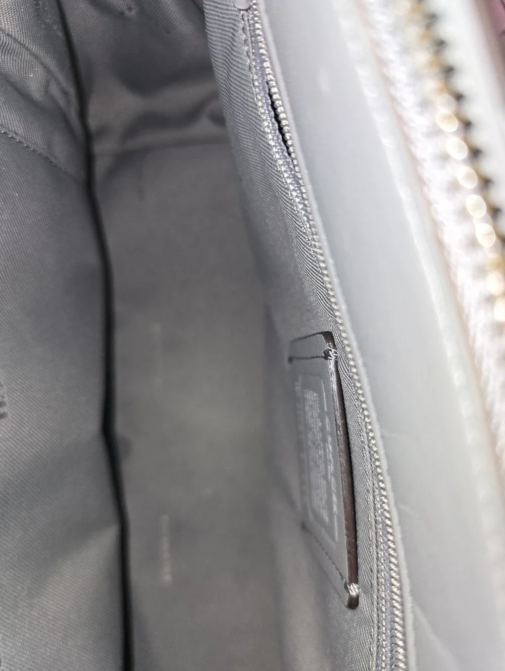 Coach Swagger 27 bag in a grey pebbled leather finish.